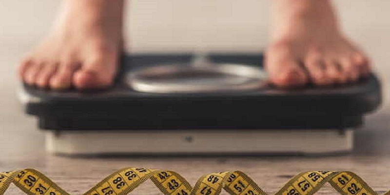 bilancia peso obesità